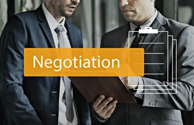 "how to negotiate in business image with people negotiating"
